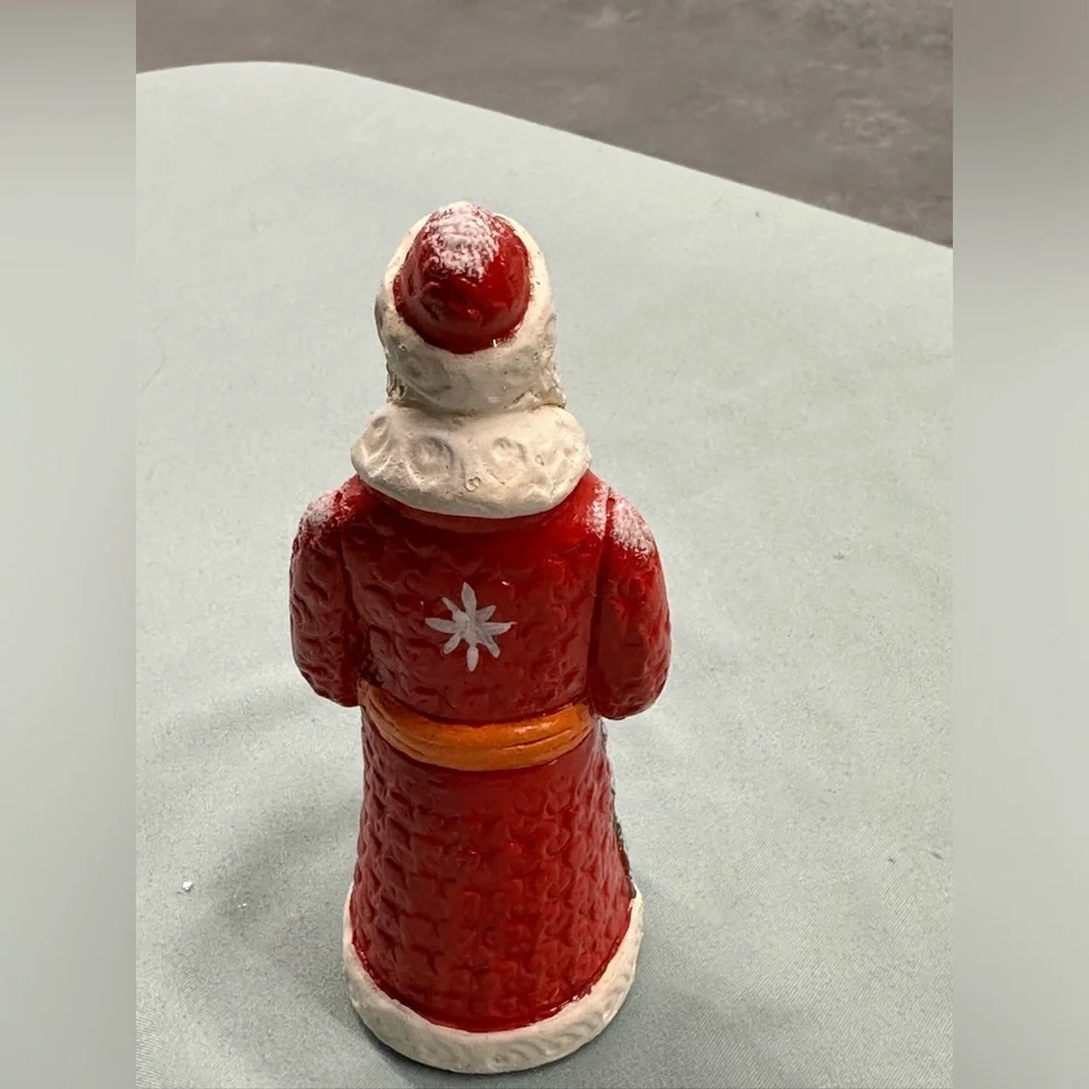 Resin Santa figure carries a special greeting